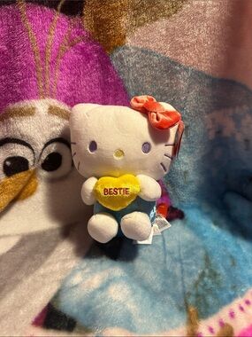 Sanrio Hello Kitty Plush with Yellow Heart and Coral Bow